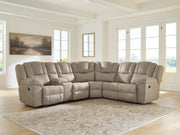 Signature Design by Ashley Pearce-Pike reclining sectional sofa with plush cushions and reclining features in a modern living room setting.