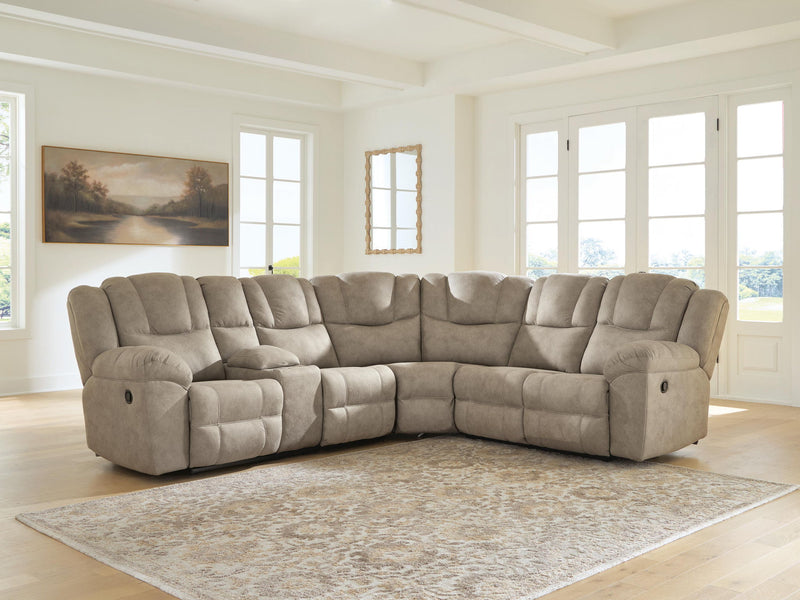Signature Design by Ashley Pearce-Pike reclining sectional sofa with plush cushions and reclining features in a modern living room setting.