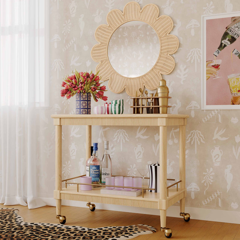TOV Furniture Slosh bar cart in natural ash wood with two shelves and metal frame, modern design for stylish beverage storage.