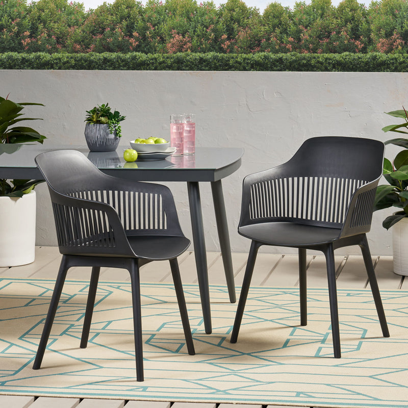 Set of two Noble House Dahlia chairs with upholstered seats and wooden legs, featuring elegant design and contemporary style.