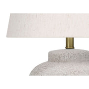 Modern concrete table lamp in cream color by 8th Street, featuring a sleek, minimalist design suitable for contemporary interiors.