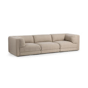 Classic Home Adalynne stationary sectional sofa with plush cushions and modern design in a living room setting.