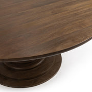 Classic Home Hera round dining table with wooden finish, showcasing its smooth circular surface and sturdy table base.