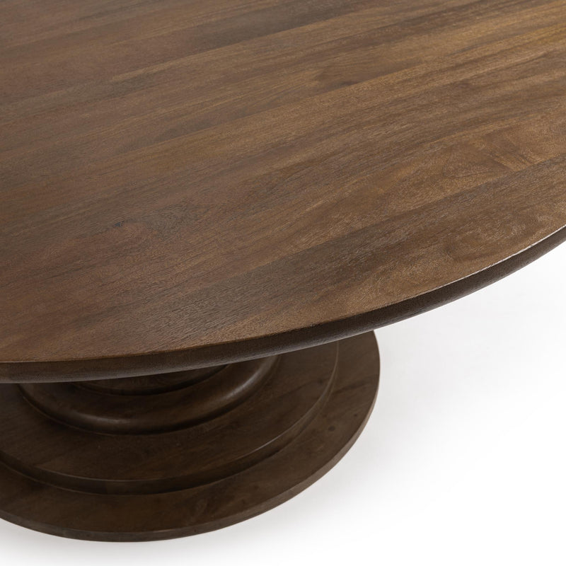 Classic Home Hera round dining table with wooden finish, showcasing its smooth circular surface and sturdy table base.