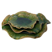 Set of three ceramic wall decor pieces by Uttermost featuring textured, modern designs for stylish interior wall art.