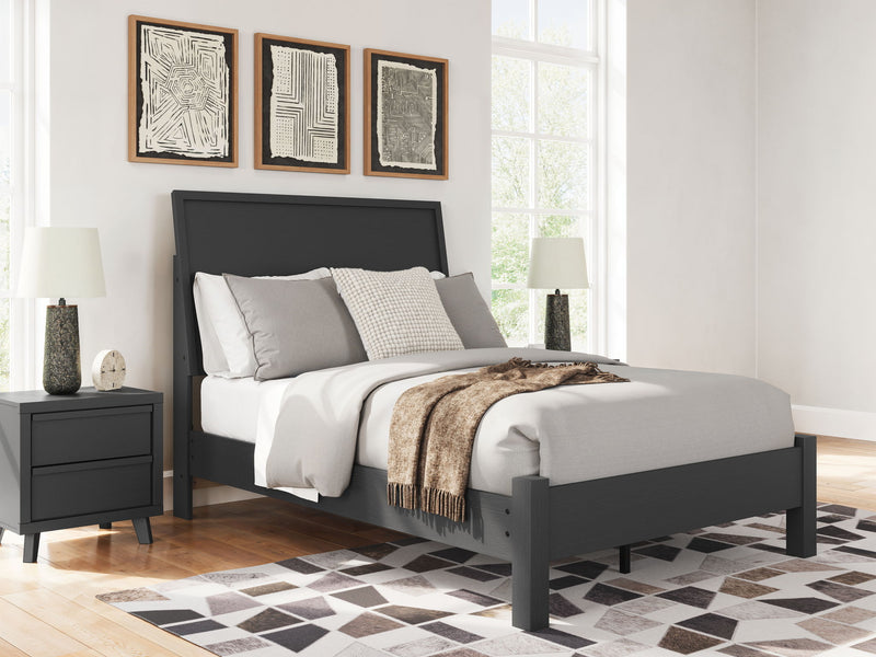 Signature Design by Ashley Danziar panel bed with low footboard, showcasing a sleek wooden frame and modern design