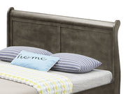 Elegant Glory Furniture trundle bed with a classic design, featuring a wooden frame and a hidden pull-out sleeping drawer.