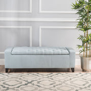 Noble House Guernsey storage ottoman with tufted top, upholstered in neutral fabric, serving as a stylish, functional living room piece.
