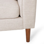 Contemporary Noble House 3-seater sofa with accent pillows, upholstered in neutral fabric, in a modern living room setting.