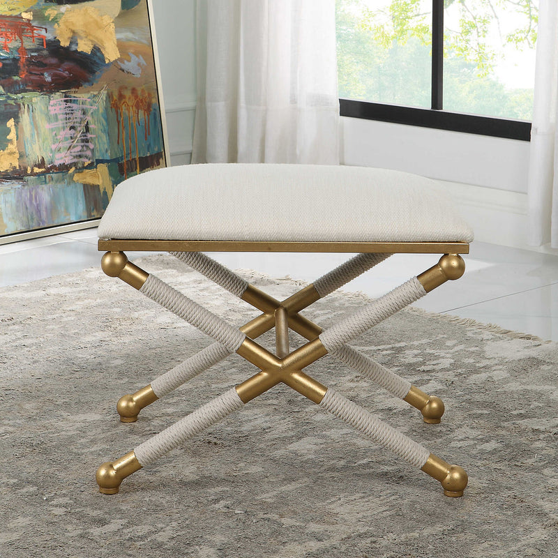 Uttermost Socialite small beige accent bench with cushioned top and wooden legs, ideal for entryways or living spaces.