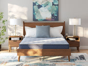 Sierra Sleep® by Ashley Peak 2.0 Bonnell hybrid mattress showing a plush, supportive surface with detailed quilting and fabric edges.