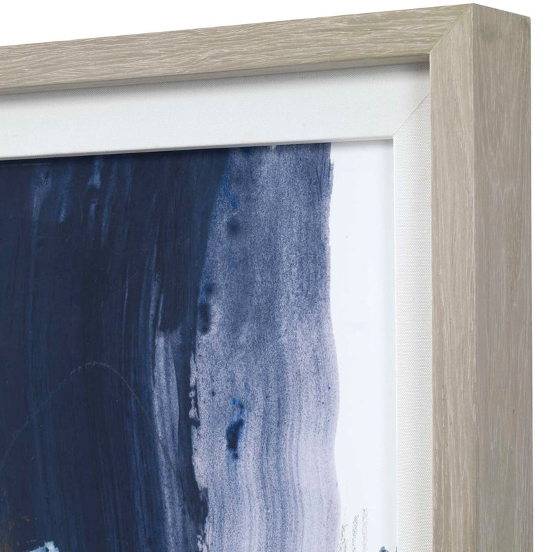 Abstract blue framed print by Uttermost, showcasing modern artwork with a sleek black frame.