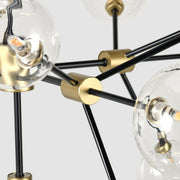 Black and gold Phoenix chandelier by Classic Home featuring elegant metal arms and decorative detailing.