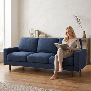 Dark blue US Pride 3-seater sofa with loose back cushions and accent pillows, perfect for a stylish living room setting.