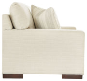 Signature Design by Ashley Maggie stationary loveseat with plush fabric and cozy cushions, perfect for living room seating.