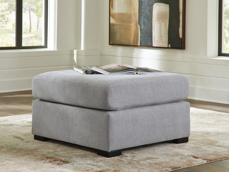 Benchcraft Lakepoint oversized accent ottoman with a nickel finish, featuring a plush upholstered top and modern design.