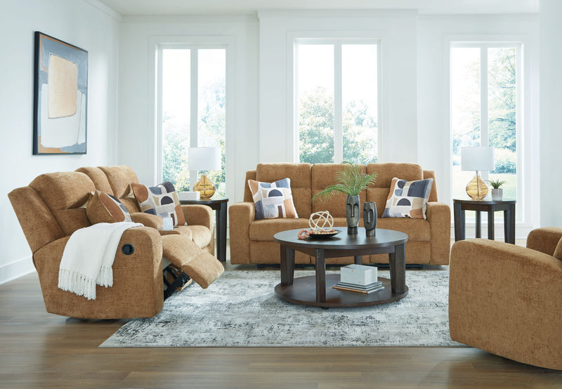 Signature Design by Ashley Kanlow reclining sofa and loveseat set in a modern living room with plush fabric and contemporary style.
