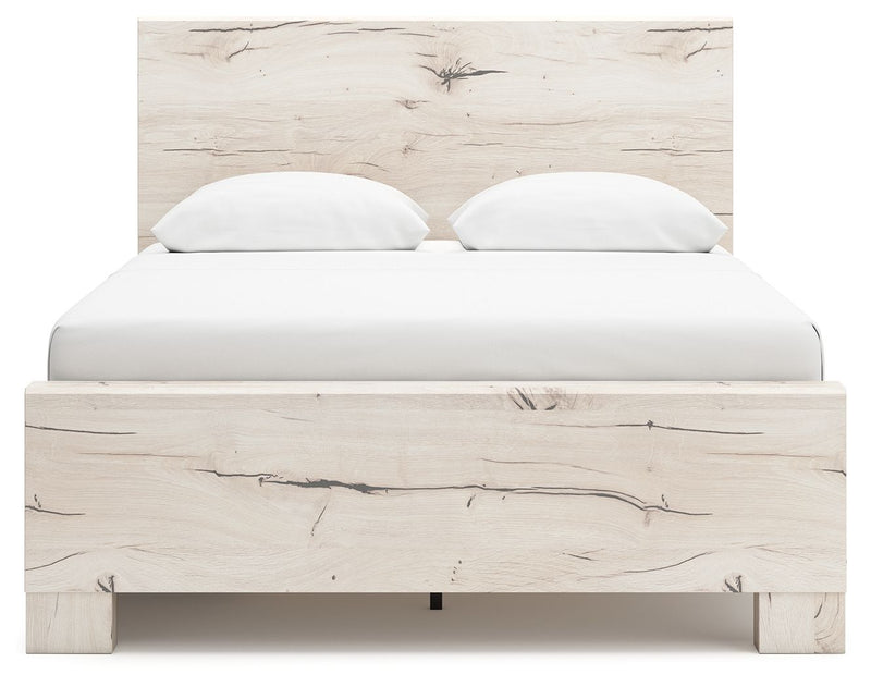 Signature Design by Ashley Lawroy panel bed with built-in storage drawers in a modern bedroom setting.