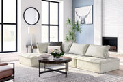 Signature Design by Ashley stationary sectional sofa with plush cushions and modern design, shown in a neutral fabric.