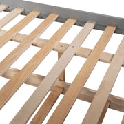 DreamHaus bunk bed with twin size trundle, featuring sturdy wooden frame and space-saving design for kids' bedroom.