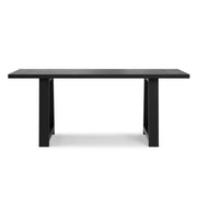 Simpli-Home Whitley dining table with a wooden top and sturdy legs, perfect for family meals and gatherings.