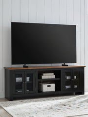 Wildenauer - XL TV Stand With Fireplace Option - Brown / Black - R&R Furniture Gallery (Fountain Valley, CA)
