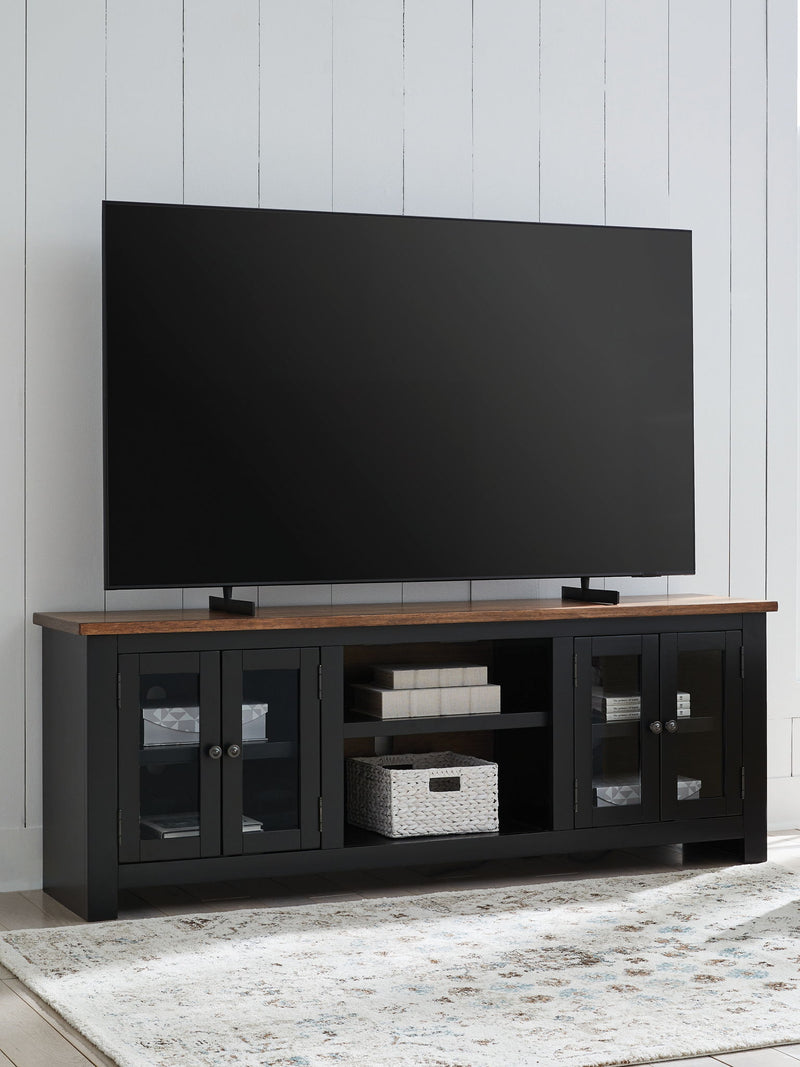 Wildenauer - XL TV Stand With Fireplace Option - Brown / Black - R&R Furniture Gallery (Fountain Valley, CA)
