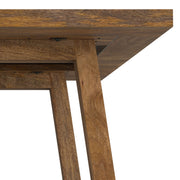 Simpli-Home Whitley dining table with wooden surface and sturdy legs, ideal for family meals in a modern dining room.