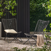 Set of two gray outdoor wicker chairs with geometric cross metal bases by Noble House, ideal for patio or garden seating.