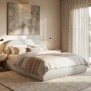 Jennifer Taylor Home Archie Puffy Grounded upholstered platform bed with plush headboard and sleek frame, shown in a modern bedroom setting.