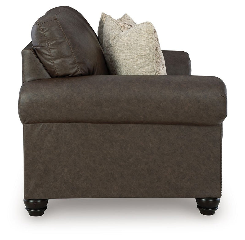 Benchcraft Roxmere living room set with stationary chair and matching ottoman, featuring plush upholstery and modern design.