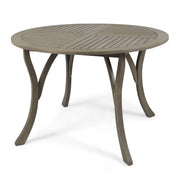 Hermosa outdoor acacia wood dining table with a circular design by Noble House, perfect for outdoor patio or garden dining spaces.