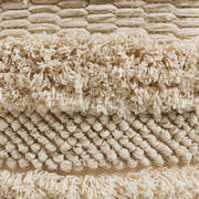Beige cotton Yorba accent pouf by TOV Furniture, round and soft, ideal for adding cozy style to living spaces.