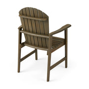 Set of two Noble House outdoor weather-resistant acacia wood Adirondack dining chairs with wide armrests and slatted seats.