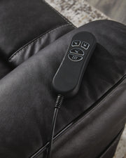 Signature Design by Ashley Oatman Power Lift Recliner in brown fabric with padded armrests and reclining mechanism.