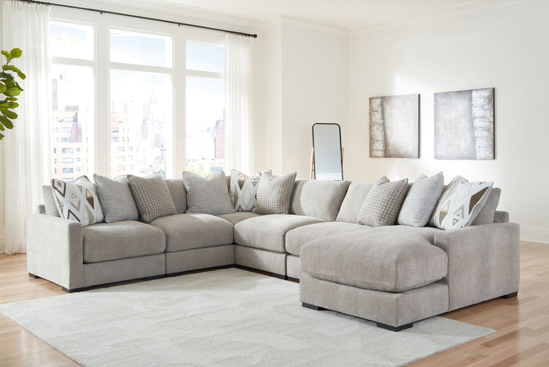 Benchcraft Aslan Court 5-piece sectional living room set with matching ottoman, featuring plush cushions and modern fabric upholstery.