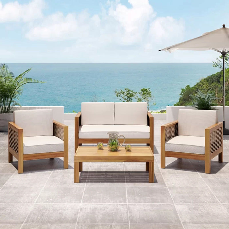 Outdoor 4-seater acacia wood chat set with wicker accents and beige cushions by Noble House, ideal for patio or garden seating.