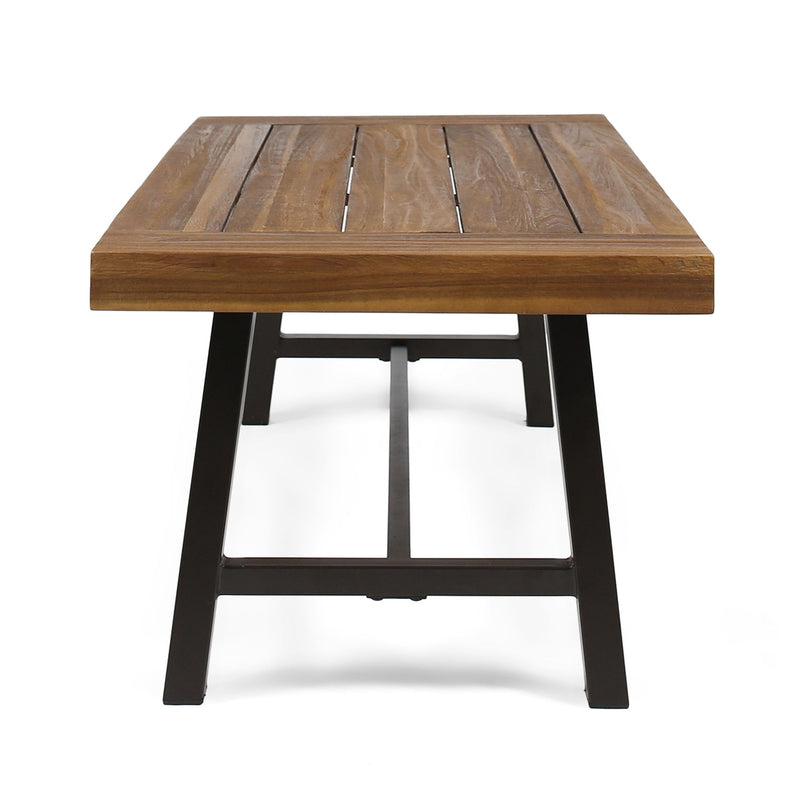 Noble House Carlisle industrial coffee table with natural wood finish and slat panel design, modern living room furniture piece.