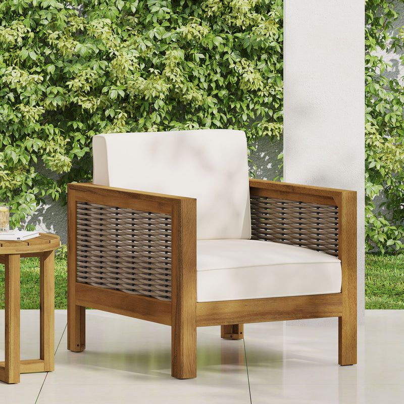 Outdoor acacia wood club arm chair with wicker accents, featuring a sturdy frame and comfortable cushioned seating by Noble House.