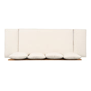 Noble House outdoor patio daybed sofa with three seats, foldable arms, and four back pillows on a patio setting.