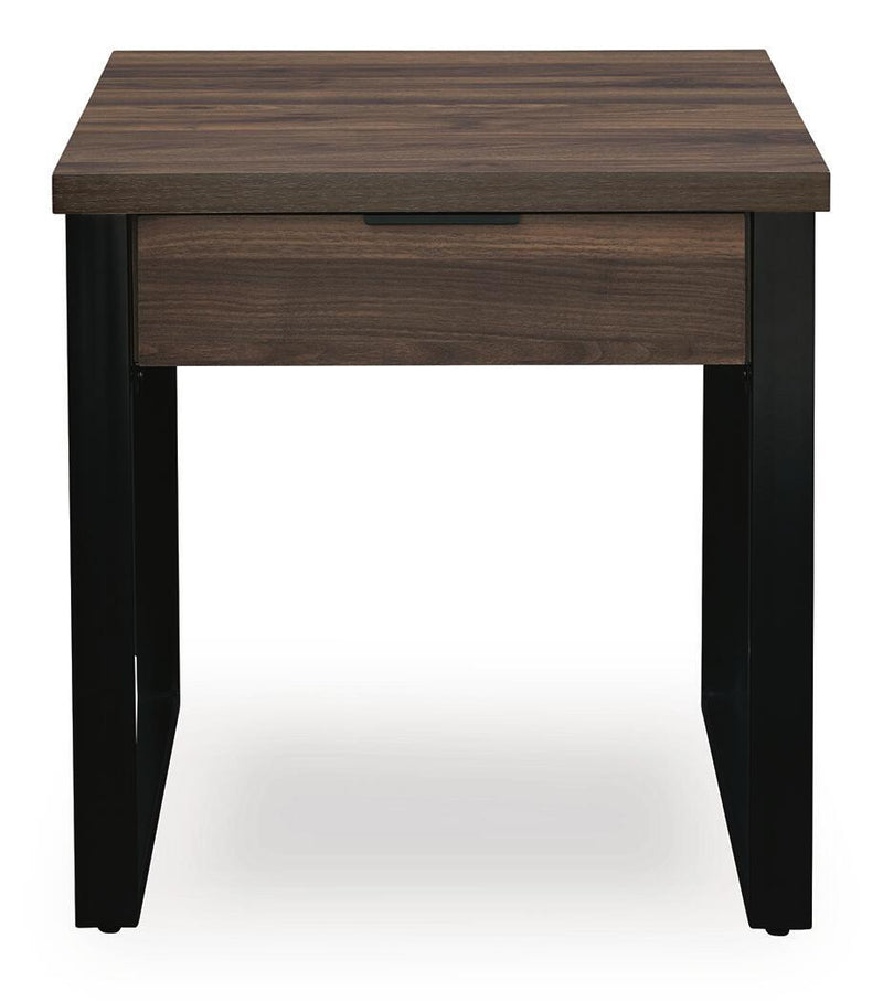 Rectangular Wickman Falls cocktail table by Signature Design Ashley, featuring a sleek wooden surface and sturdy metal legs.