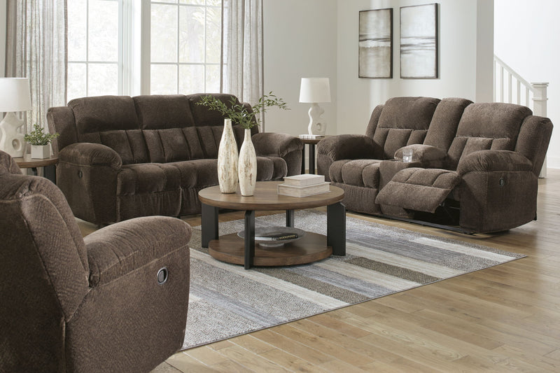 Signature Design by Ashley Frohn reclining living room set with plush sofas and loveseats, featuring padded arms and reclining features.