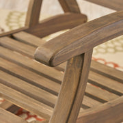 Gray outdoor reclining rocking chair by Noble House with a sturdy frame and comfortable design for outdoor relaxation.