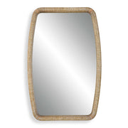 Gold Tiki accent mirror by Uttermost featuring a stylish, tropical-inspired tiki design with a round reflective surface.