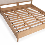 Classic Home Alisen upholstered bed with padded headboard and neutral fabric, showcasing a modern, stylish bedroom setup.