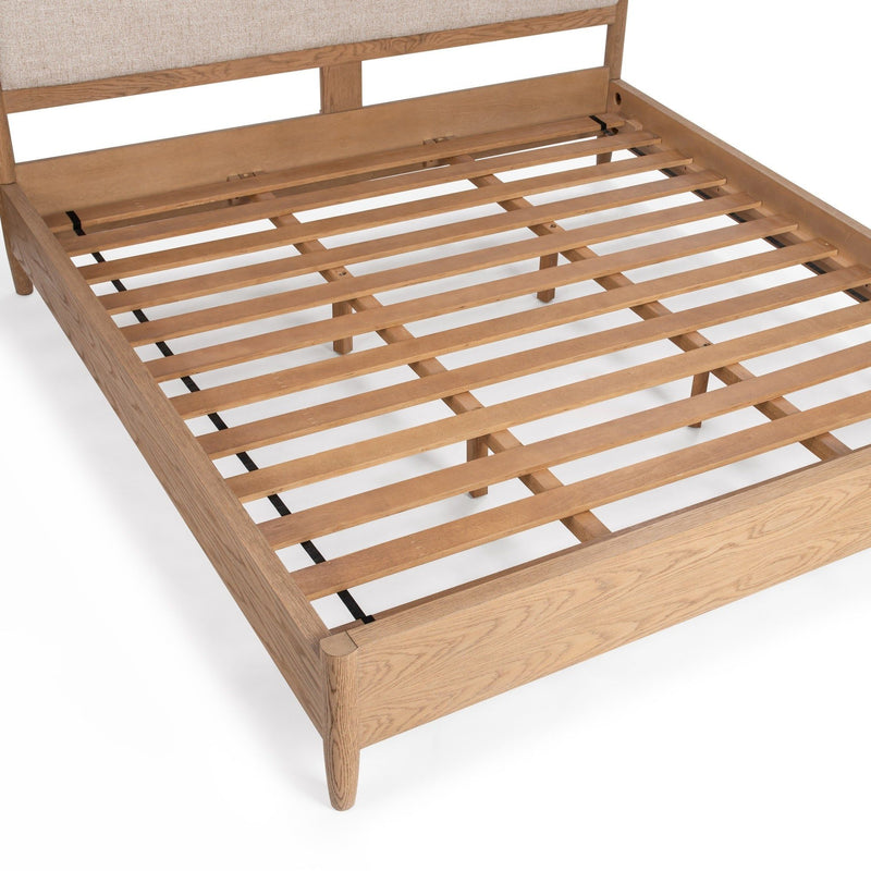 Classic Home Alisen upholstered bed with padded headboard and neutral fabric, showcasing a modern, stylish bedroom setup.