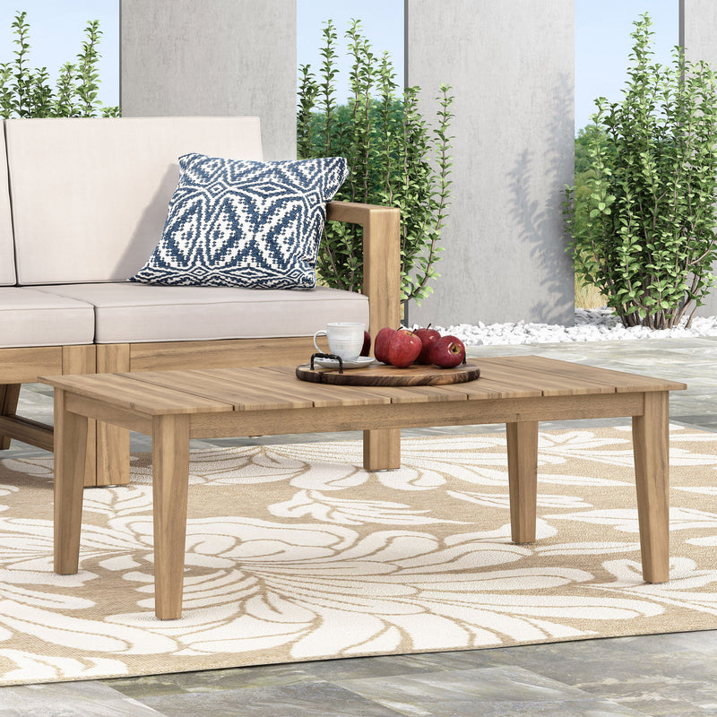 Light brown outdoor coffee table with slat panel top by Noble House, showcasing a sturdy wooden design for patio or garden use.