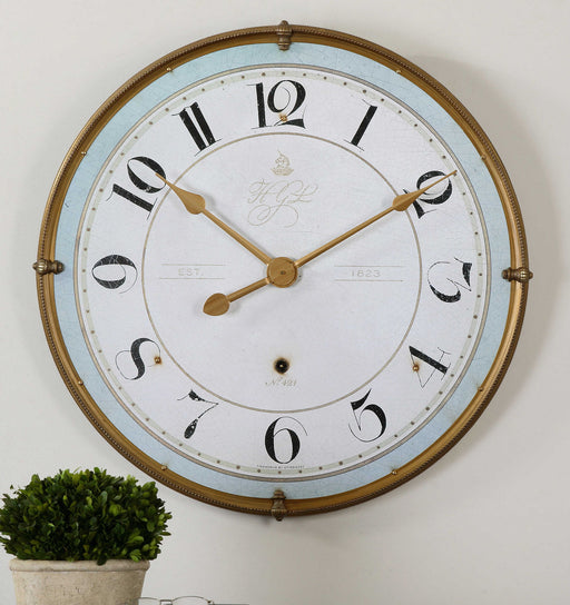 Uttermost Torriana gold wall clock with a round face and minimalist design, perfect for modern home decor.