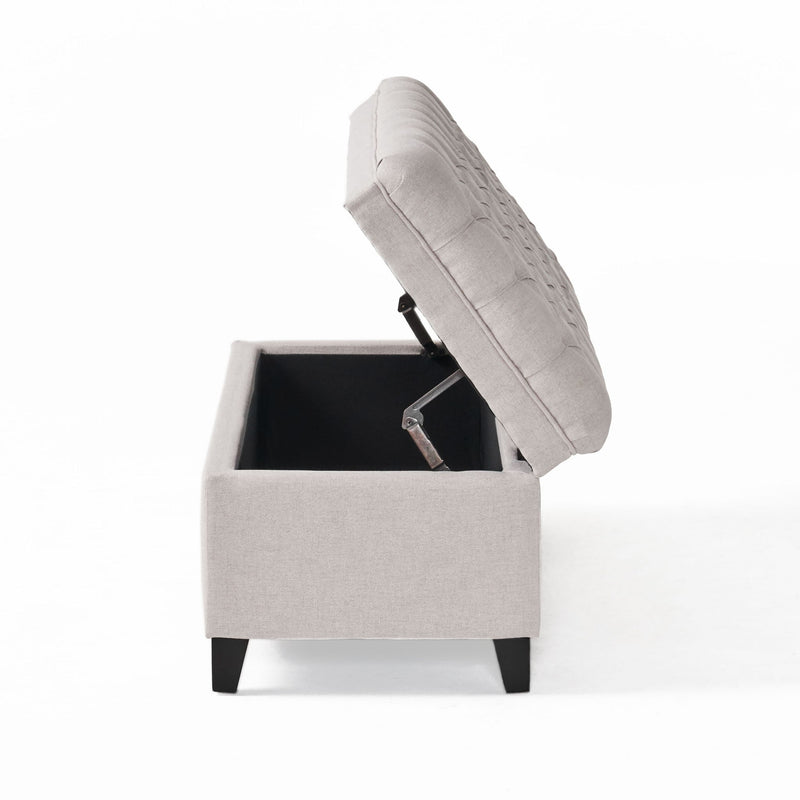 Noble House Juliana storage ottoman with birch wood legs, cushioned top, and spacious interior for added seating and storage.