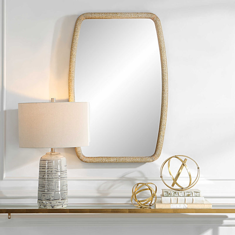 Gold Tiki accent mirror by Uttermost featuring a sleek, modern design with a polished gold finish and a stylish tiki-shaped frame.